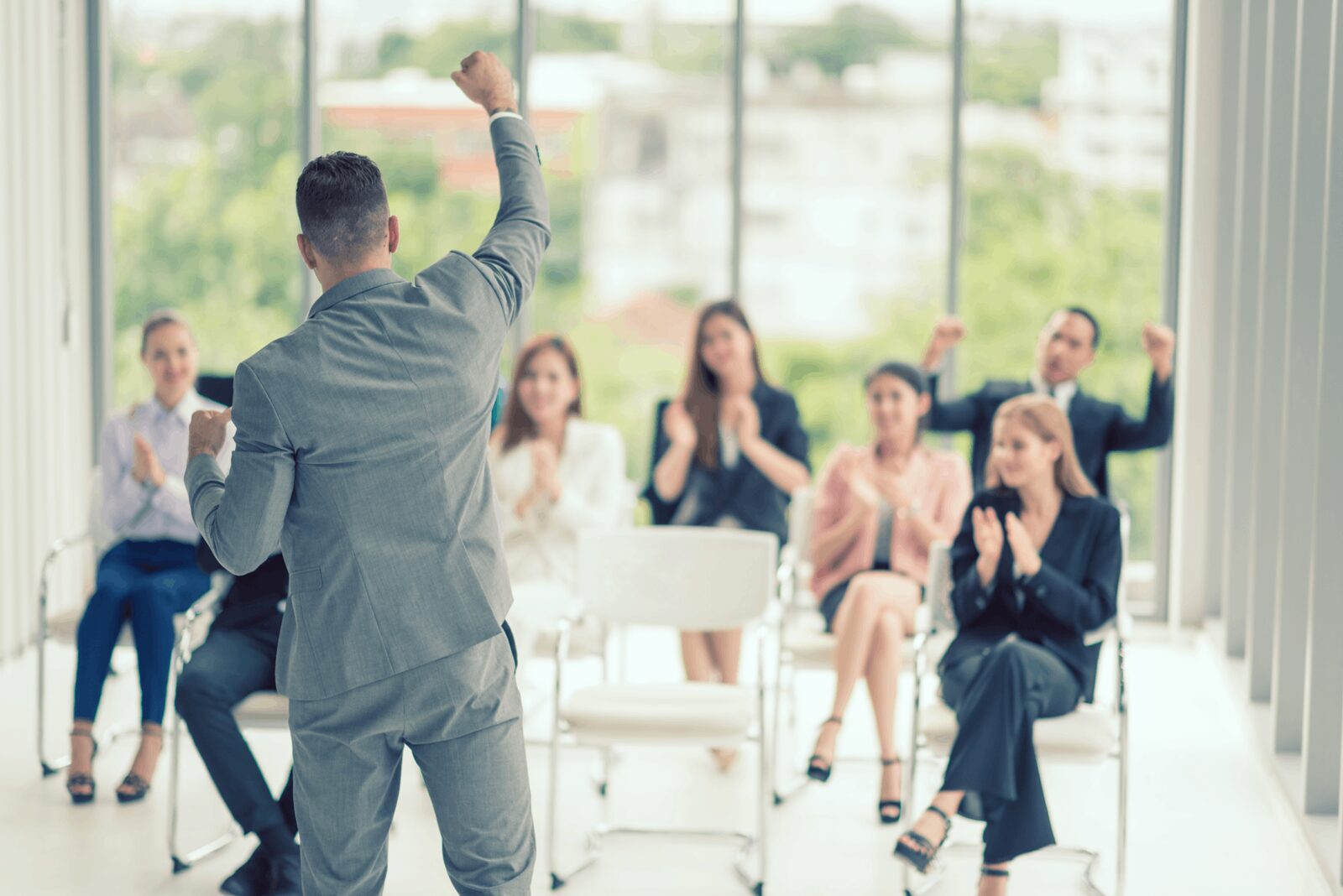 A speaker presents to a professional audience, demonstrating Career Calling International's expertise in training.