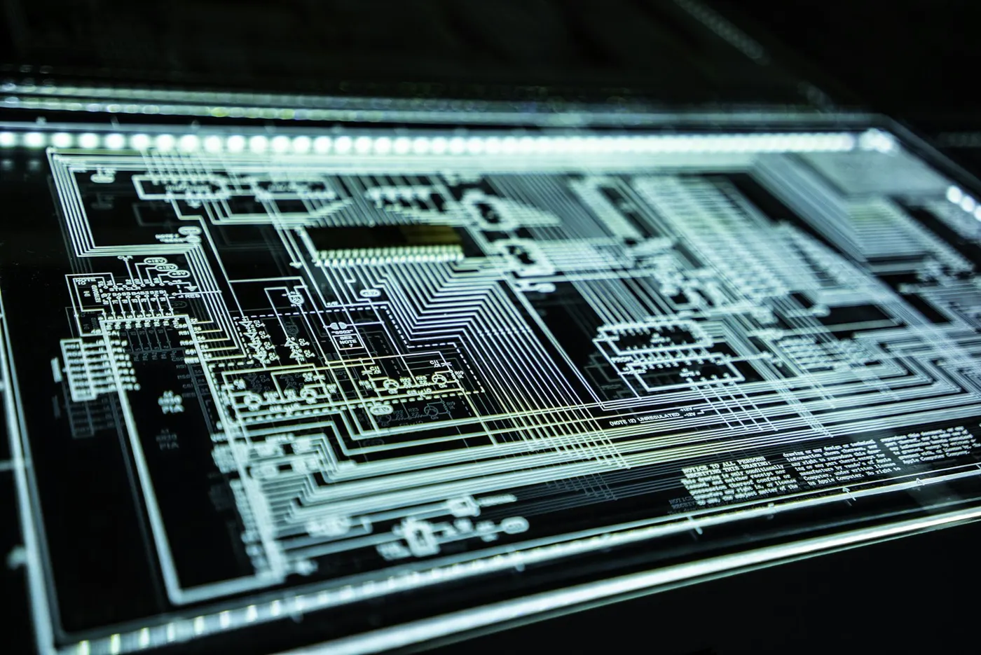 A glowing circuit board schematic represents the complex technology involved in vocational education and training.