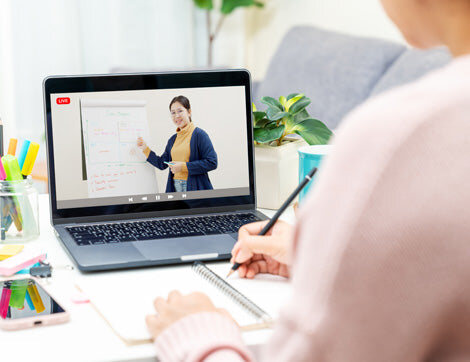 A learner joining an online class on a laptop